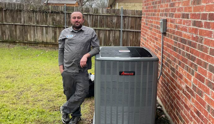 A technician with HVAC unit