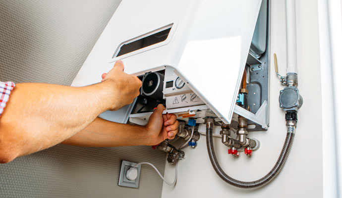 Heating system repair being performed by professionals.