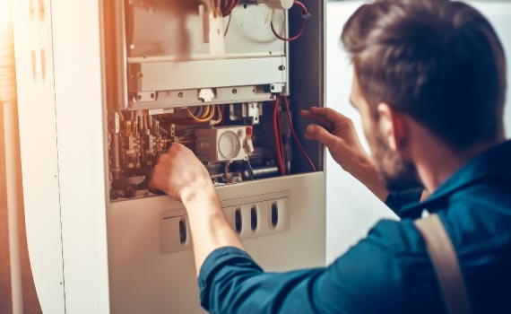 worker installing new furnace
