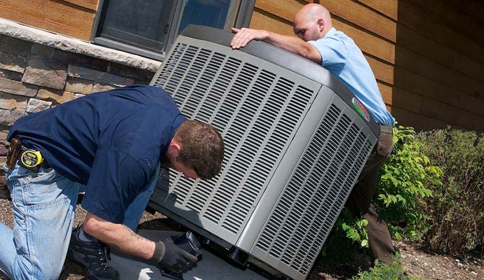 Technicians installing heating system